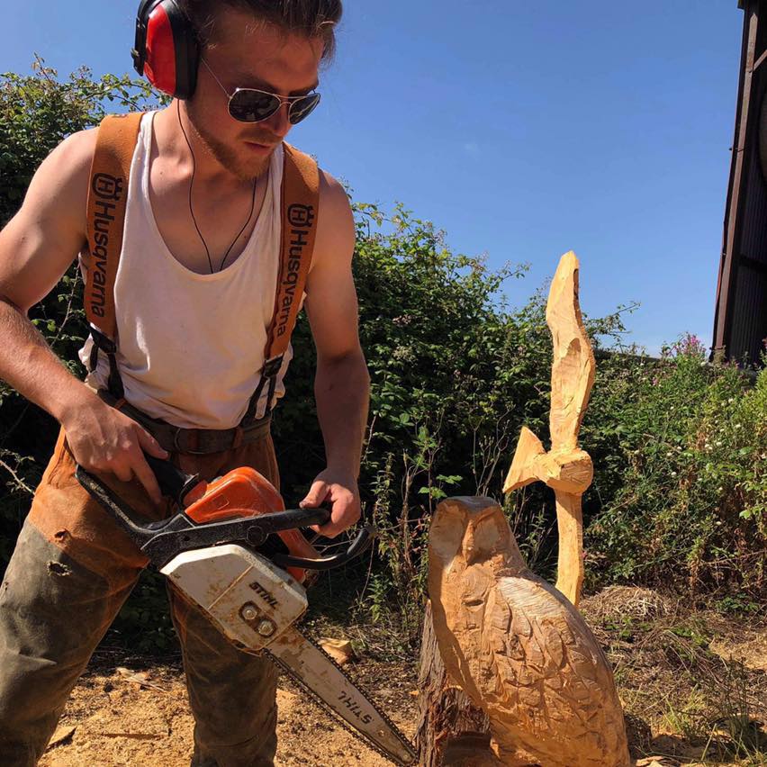 Chainsaw carving of wooden sculpture